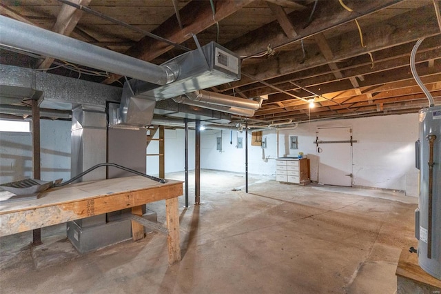 basement with electric panel and water heater