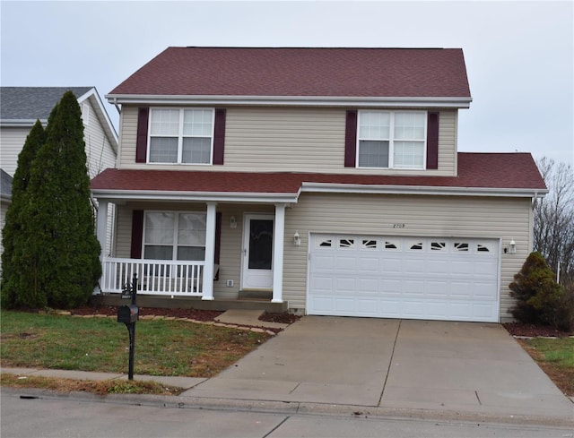 view of front of house featuring a porch and a garage