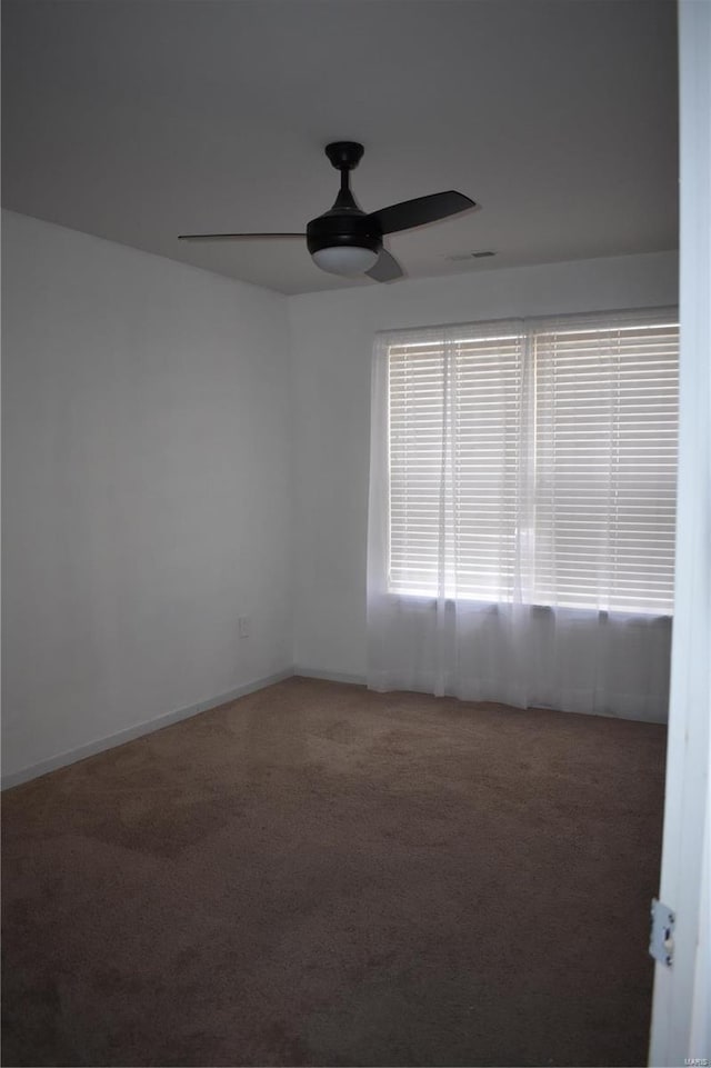 unfurnished room with carpet floors and ceiling fan