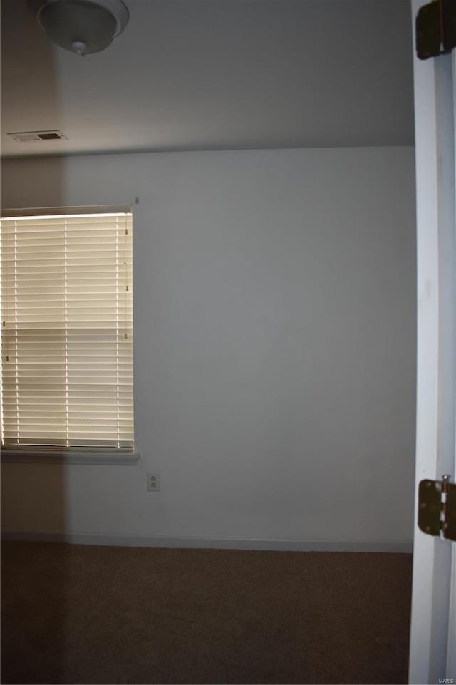 empty room with carpet flooring