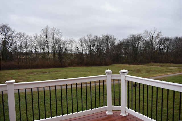 wooden terrace with a yard