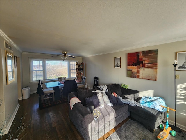 living room with a textured ceiling, a ceiling fan, baseboards, ornamental molding, and dark wood-style floors