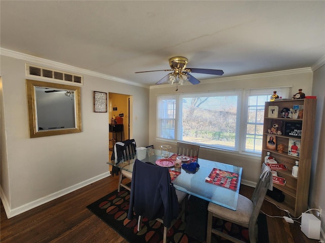 dining room featuring ceiling fan, ornamental molding, and dark hardwood / wood-style floors