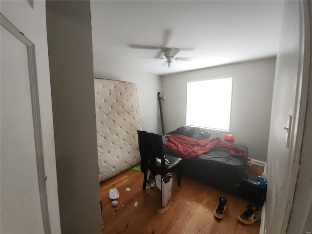 bedroom with ceiling fan and wood finished floors