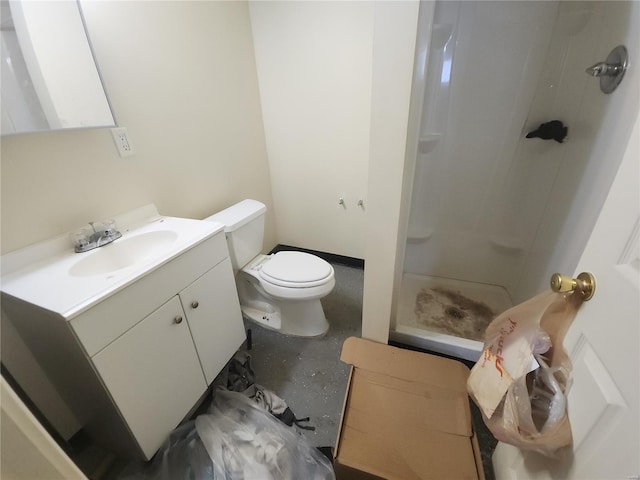 full bath featuring toilet, a stall shower, and vanity