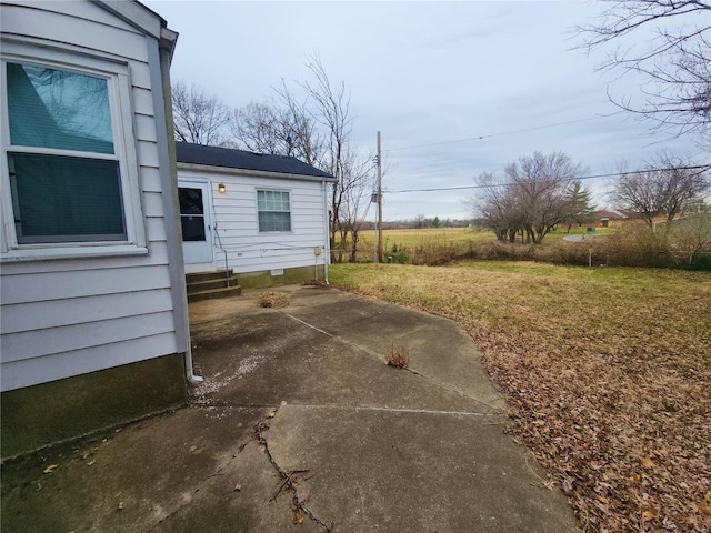 view of yard with entry steps and a patio area