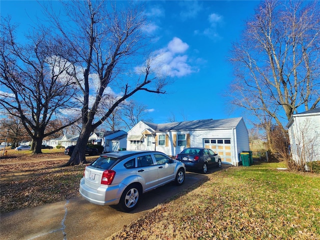 view of front of home featuring a garage and a front yard