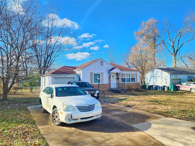 view of front of property with driveway and brick siding