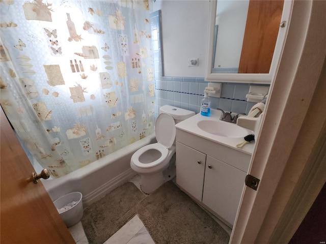 full bathroom with tile patterned floors, toilet, tile walls, vanity, and shower / bathtub combination with curtain