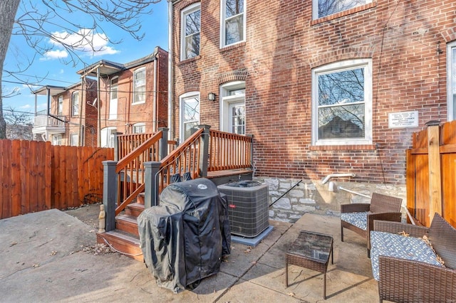 view of patio / terrace with area for grilling and cooling unit