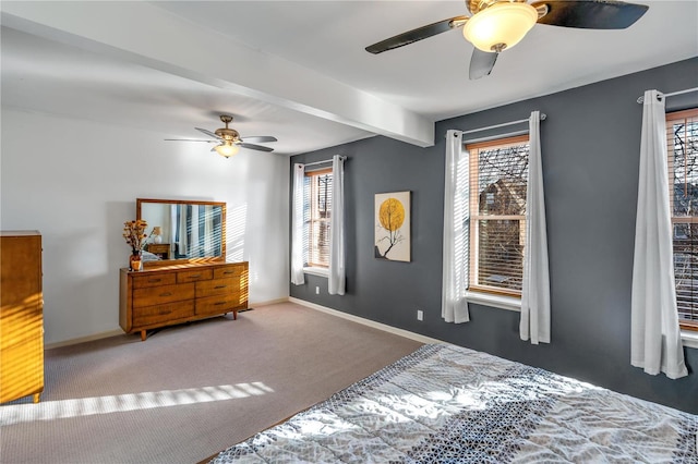 carpeted bedroom featuring beamed ceiling, multiple windows, and ceiling fan