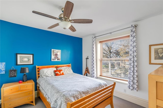 bedroom featuring ceiling fan and light colored carpet