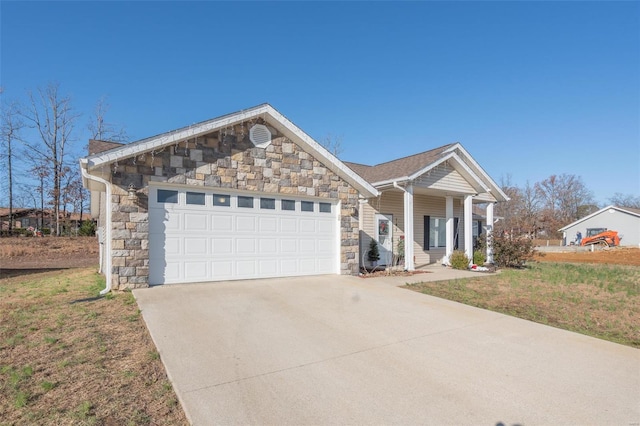 view of front of home with a front lawn and a garage