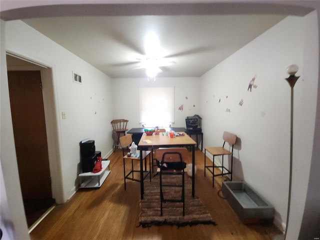 dining room with dark wood-type flooring