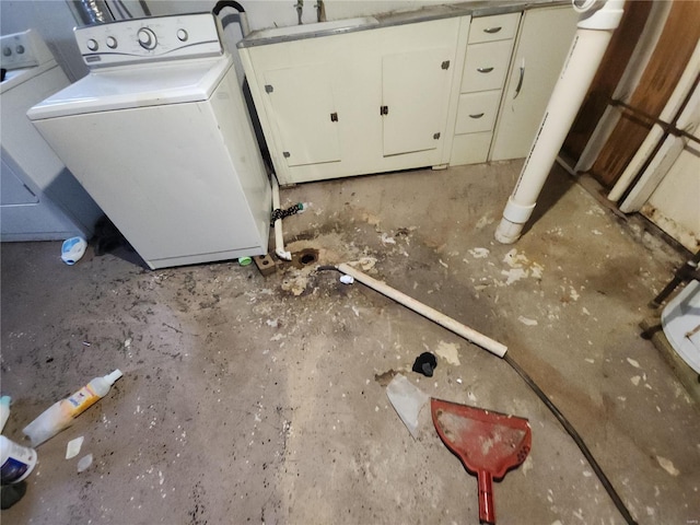 clothes washing area featuring sink and washer and dryer