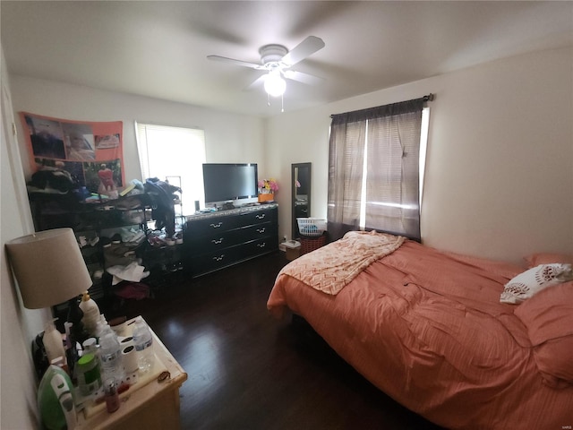 bedroom featuring ceiling fan and dark wood-type flooring