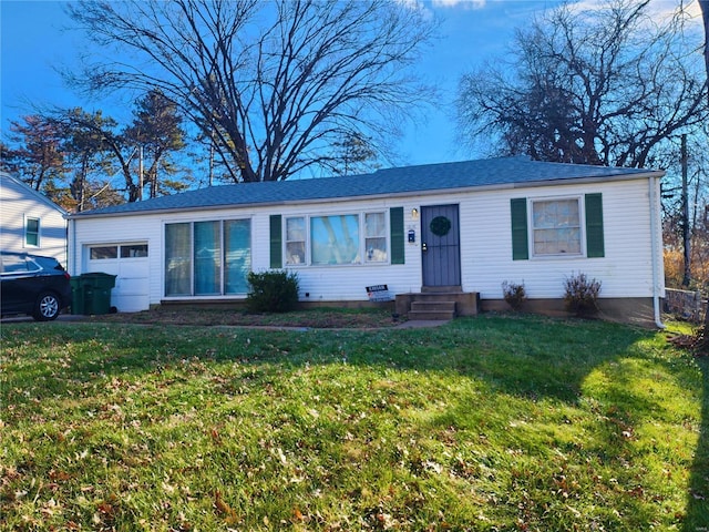 single story home with a garage, a front yard, and entry steps