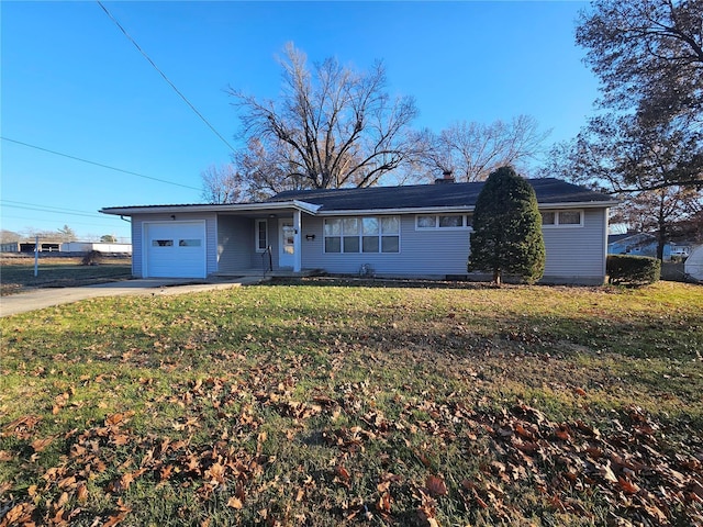 single story home with a garage and a front lawn