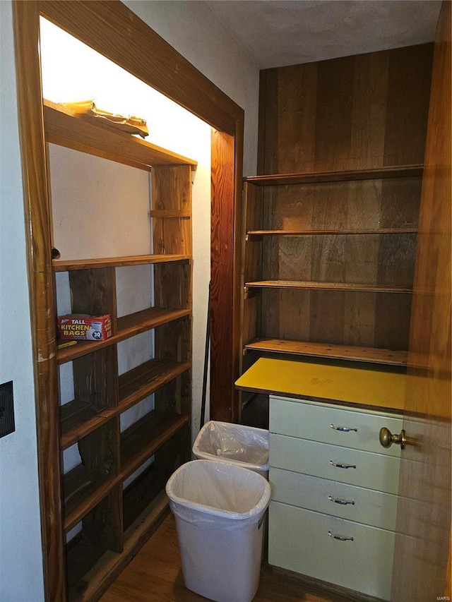 bathroom with a textured ceiling and hardwood / wood-style flooring