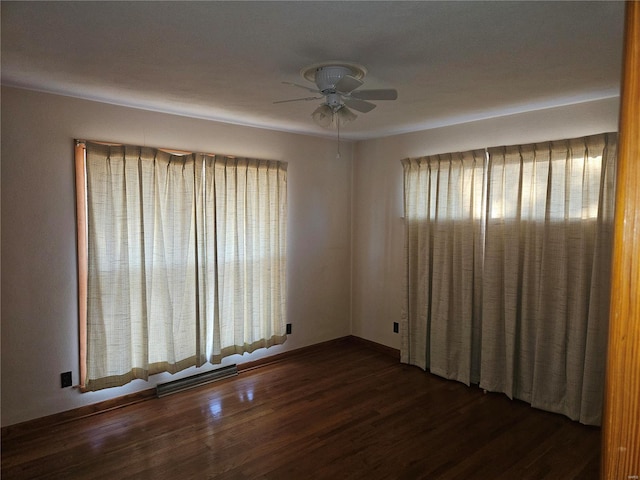 unfurnished room with dark hardwood / wood-style floors and ceiling fan