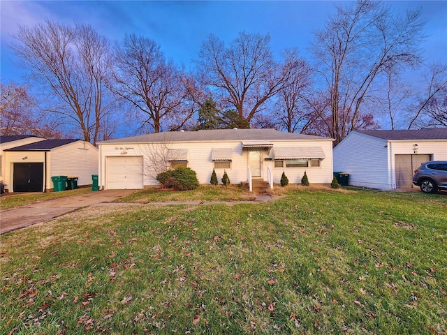 single story home featuring an attached garage, concrete driveway, and a front yard