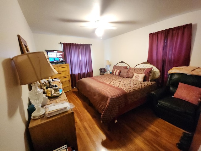 bedroom with wood finished floors and a ceiling fan