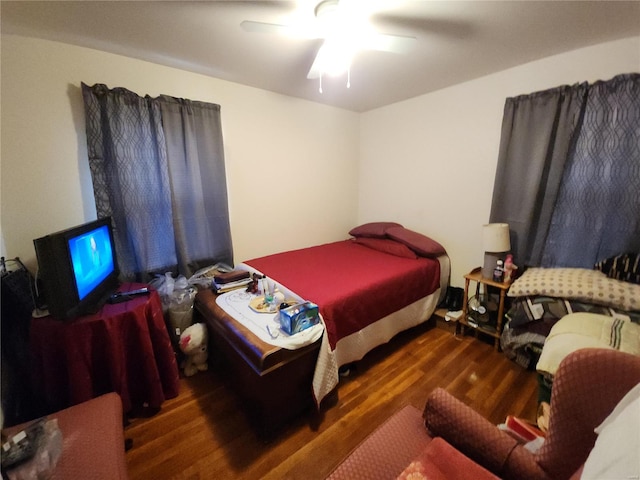 bedroom featuring dark wood-style floors and ceiling fan