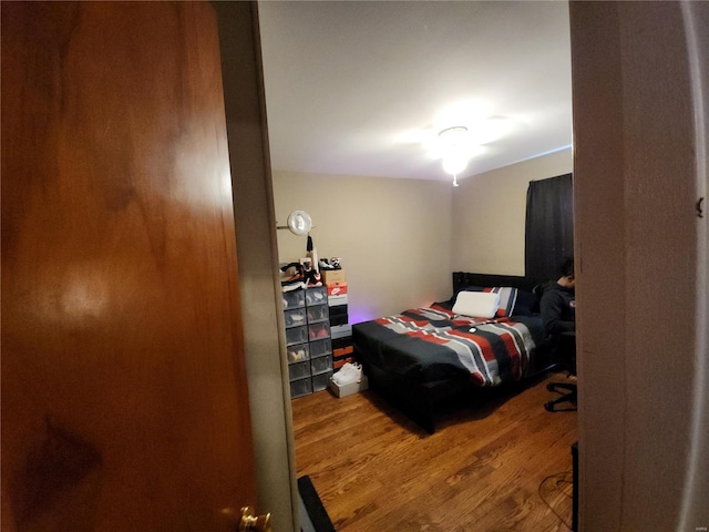 bedroom featuring wood finished floors