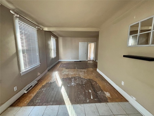 spare room with hardwood / wood-style flooring