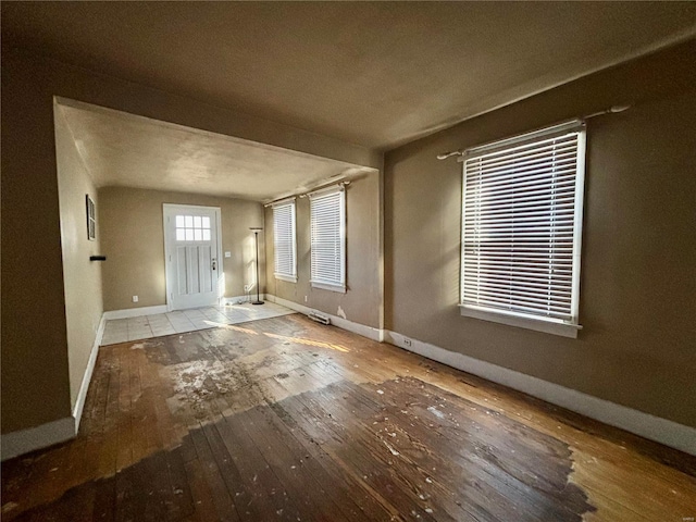 entryway featuring wood-type flooring and a textured ceiling