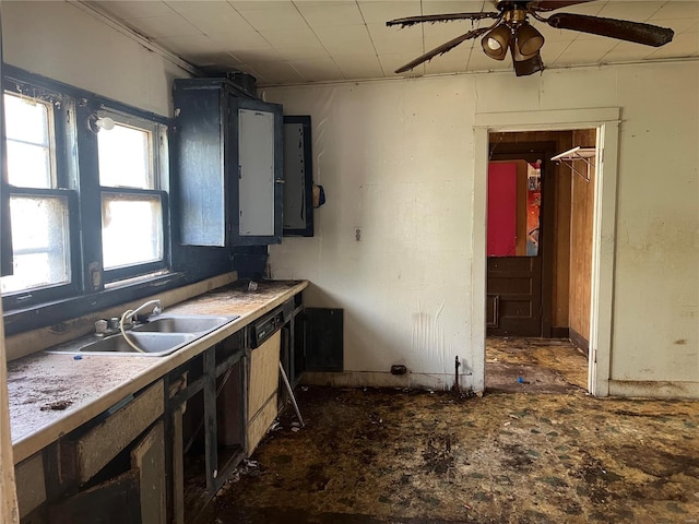 kitchen with dishwasher, ceiling fan, crown molding, and sink