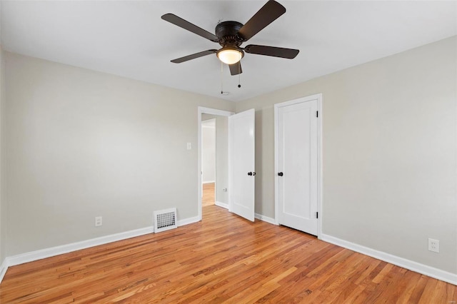 unfurnished bedroom with ceiling fan and light hardwood / wood-style floors