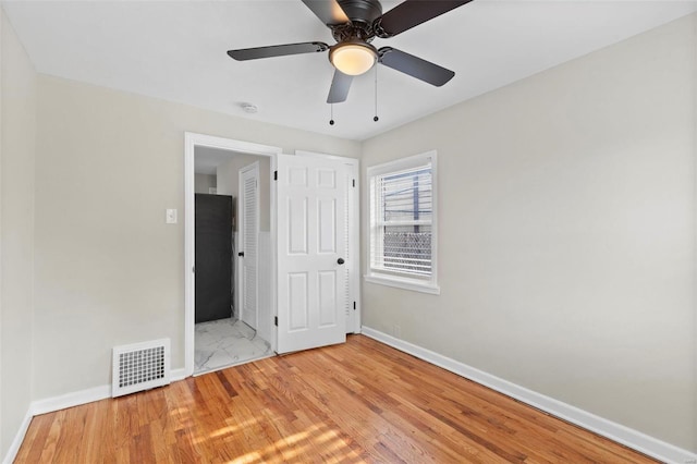 unfurnished bedroom featuring ceiling fan and light hardwood / wood-style floors