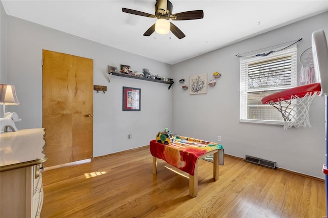 game room featuring ceiling fan and light wood-type flooring