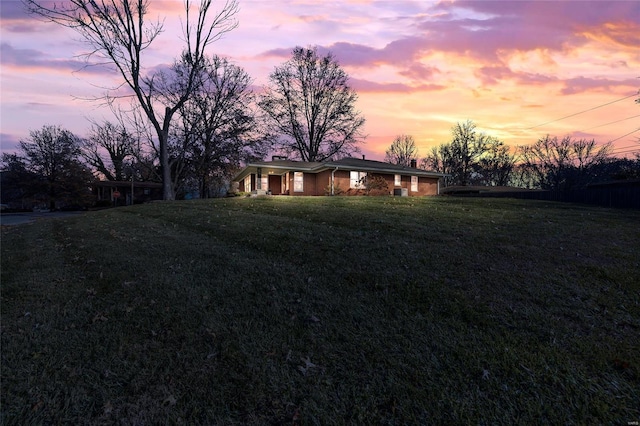 view of yard at dusk