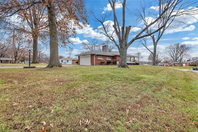 view of yard featuring a garage