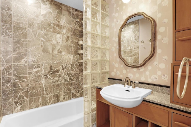 bathroom featuring vanity and washtub / shower combination