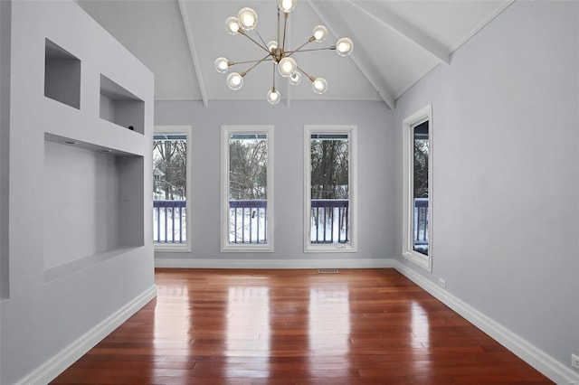 interior space featuring dark hardwood / wood-style flooring, an inviting chandelier, and lofted ceiling with beams