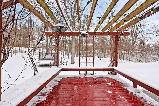 snow covered deck featuring a trampoline