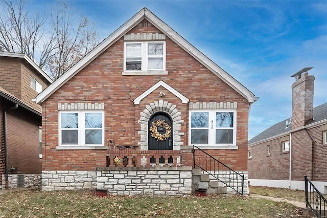 view of front of house featuring brick siding