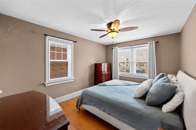 bedroom featuring ceiling fan and light hardwood / wood-style flooring