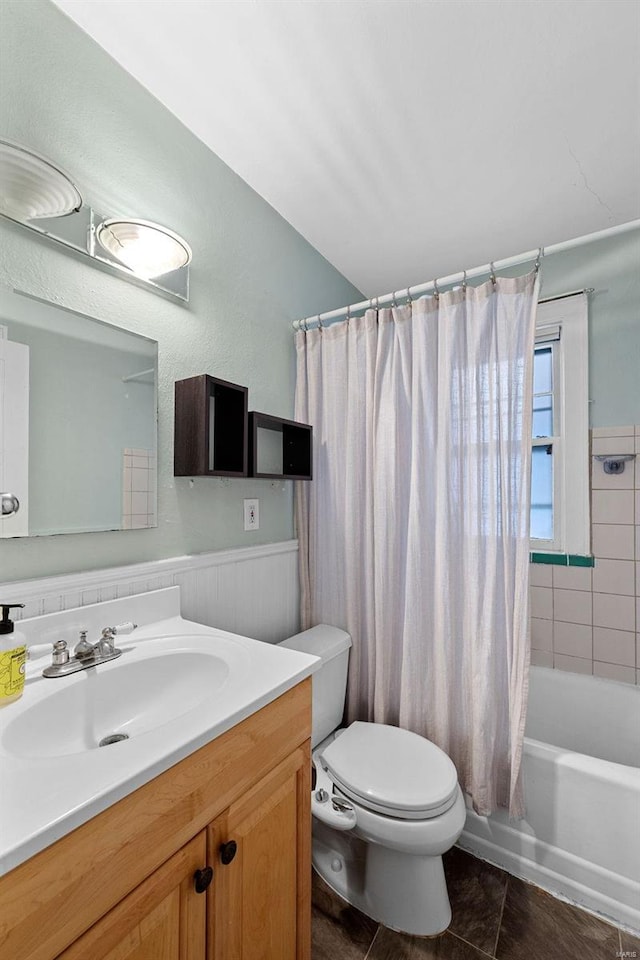 full bathroom with toilet, vanity, tile patterned floors, and shower / bath combo with shower curtain