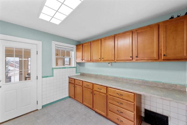 kitchen with tile walls