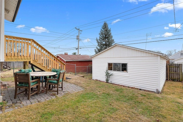 view of yard with an outbuilding and a patio