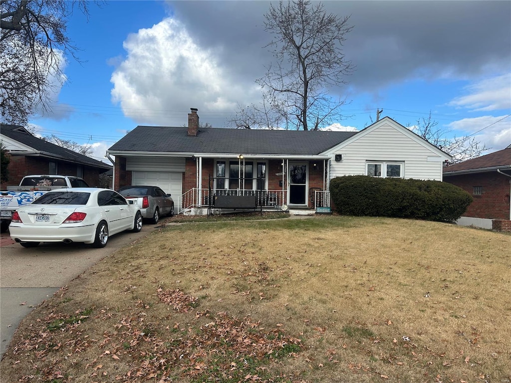 single story home with a front lawn, a porch, and a garage