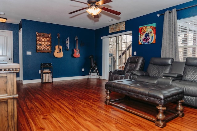 living room with hardwood / wood-style floors and ceiling fan