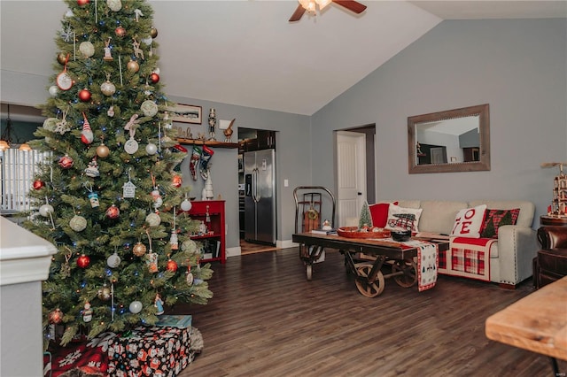 living room with lofted ceiling, dark hardwood / wood-style floors, and ceiling fan