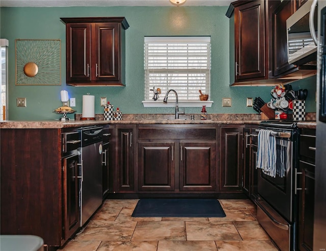 kitchen with stainless steel appliances, dark brown cabinets, and sink