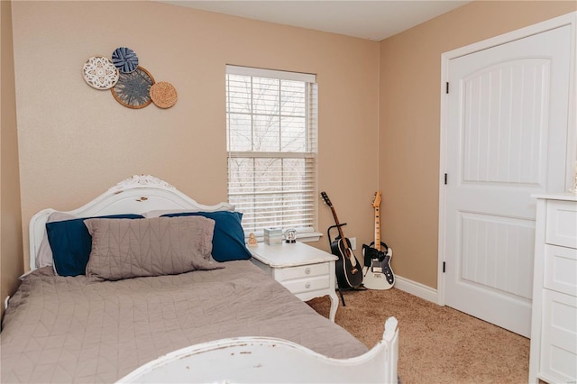 bedroom featuring light colored carpet