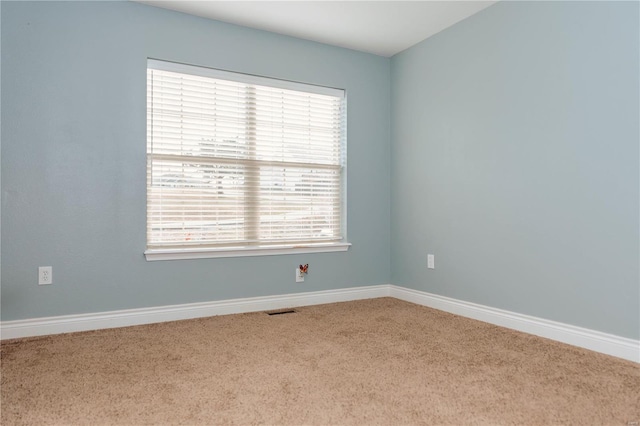 unfurnished room featuring carpet flooring